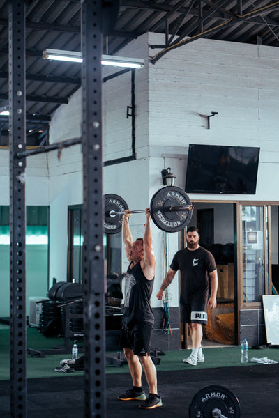 man lifting weights