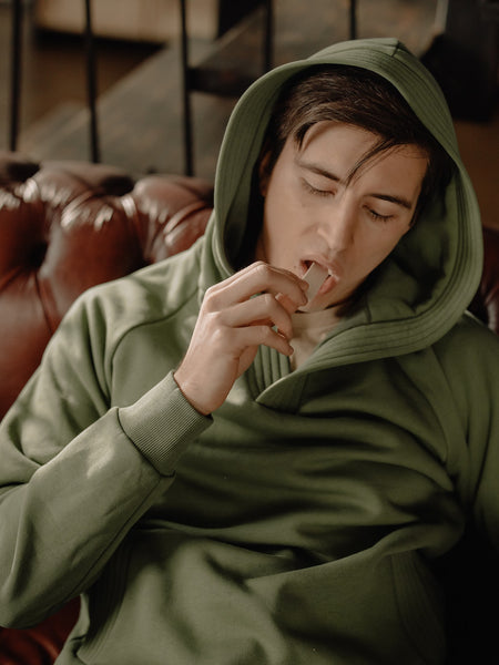 young man eating chewing gum for bad breath