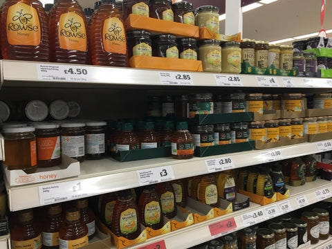 Supermarket honey on shelves in Sainsburys supermarket UK