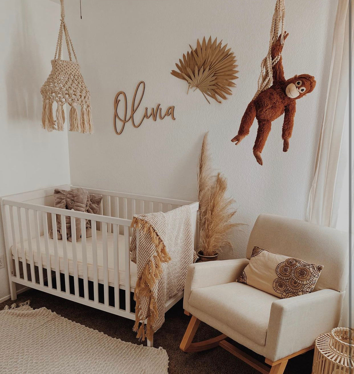 boho nursery decor with customized baby name sign