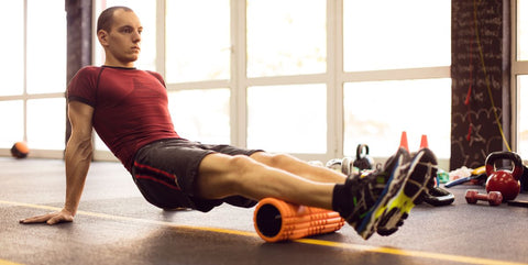 Man Stretching With Foam Roller