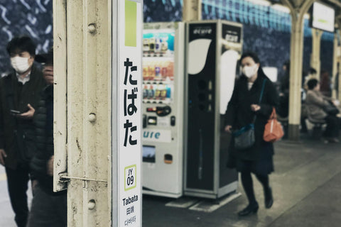 two people wearing face masks