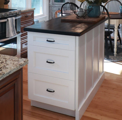 Sherwood Cabinet hardware in matte black on a white shaker style cabinet