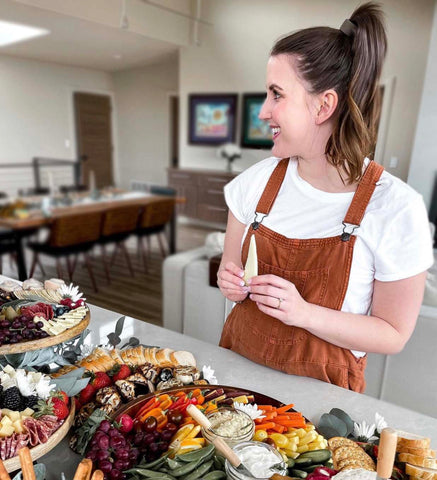 Catered food table girl wearing PONY-O hair tie