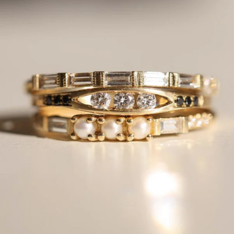 3 Pearl Baguette Equilibrium Ring stacked with other gold rings