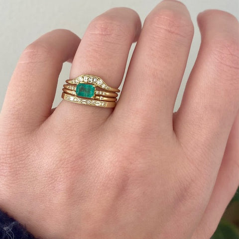 East West Equilibrium Emerald Ring stack on finger