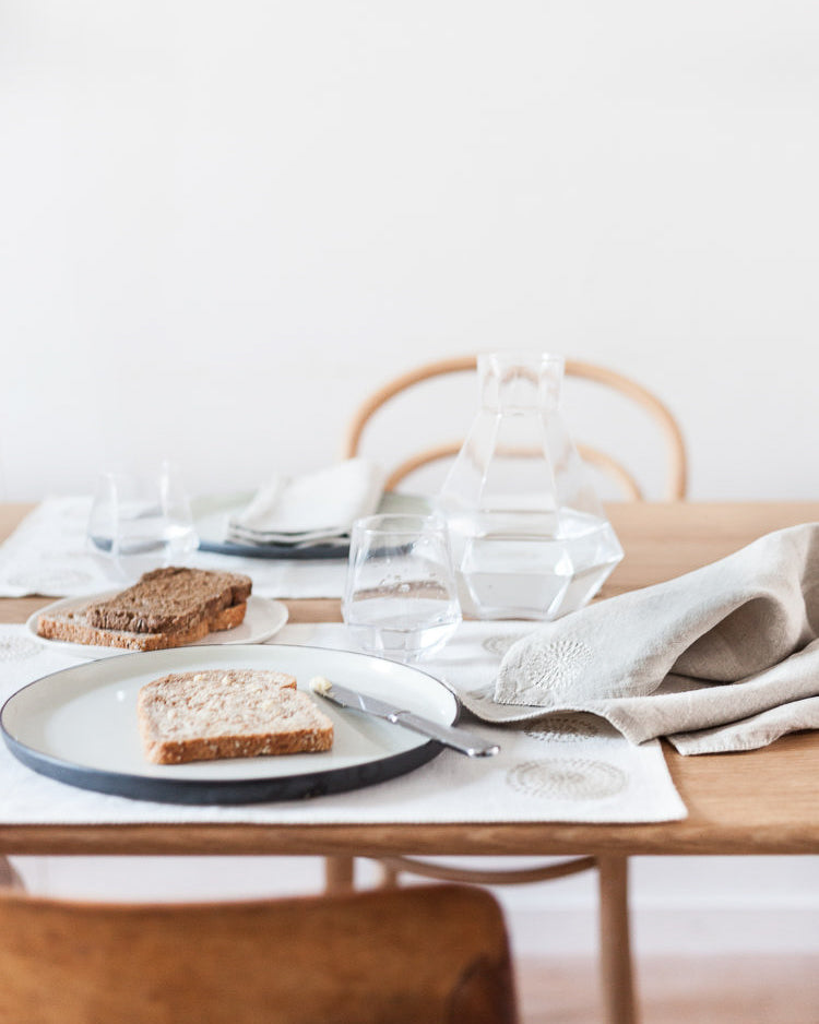 Table set for two with linen napkins from Artha Collections