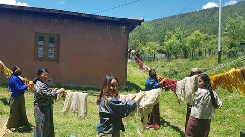 Hanging yarn out to dry before weaving throw pillows for artha collections