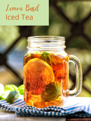 mug of lemon basil iced tea on blue and white striped towel