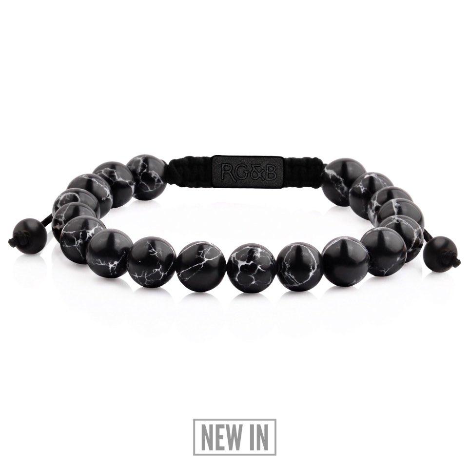 Black Stone Bead Bracelet - Our Black Stone Bead Bracelet Features Natural Stones, Waxed Cord and Brushed Black Steel Hardware. A Beautiful Addition to any Collection.