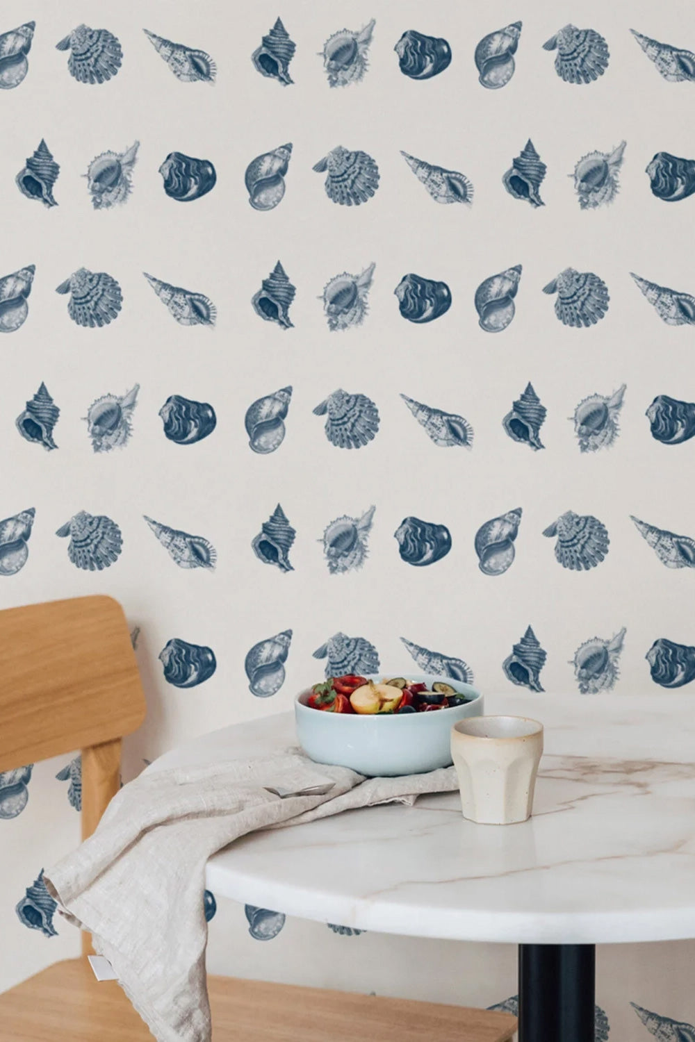 coastal seashells inspired wallpaper in dining room