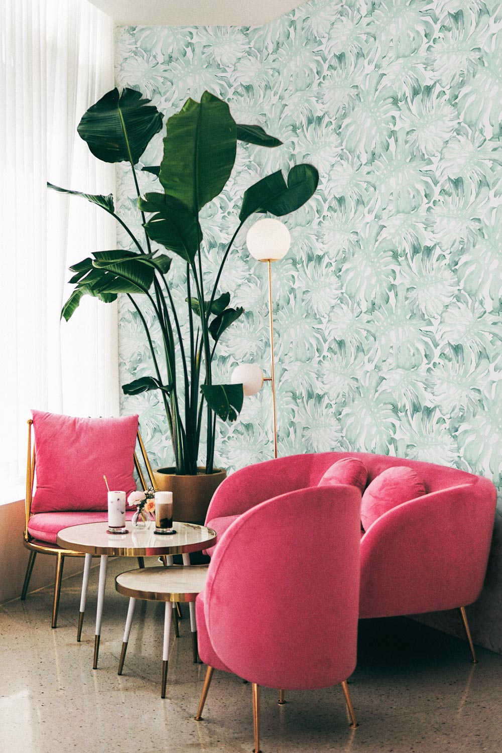 tropical green palm leaves wallpaper in living room