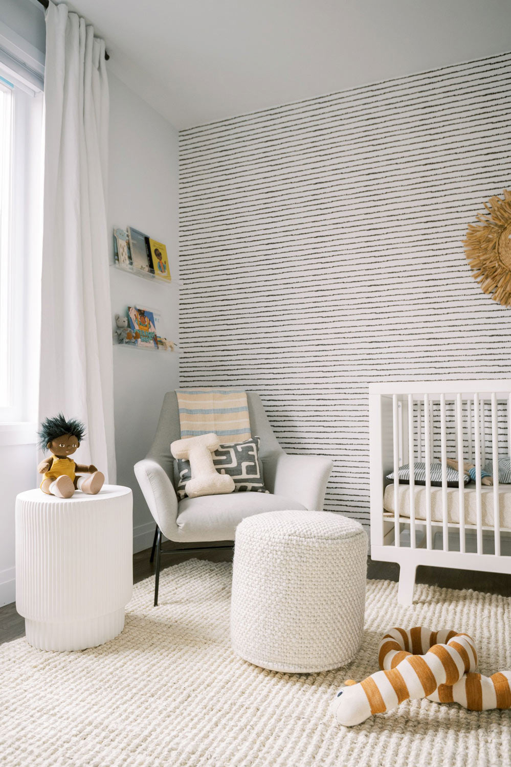 Nursery design featuring black and white removable wallpaper