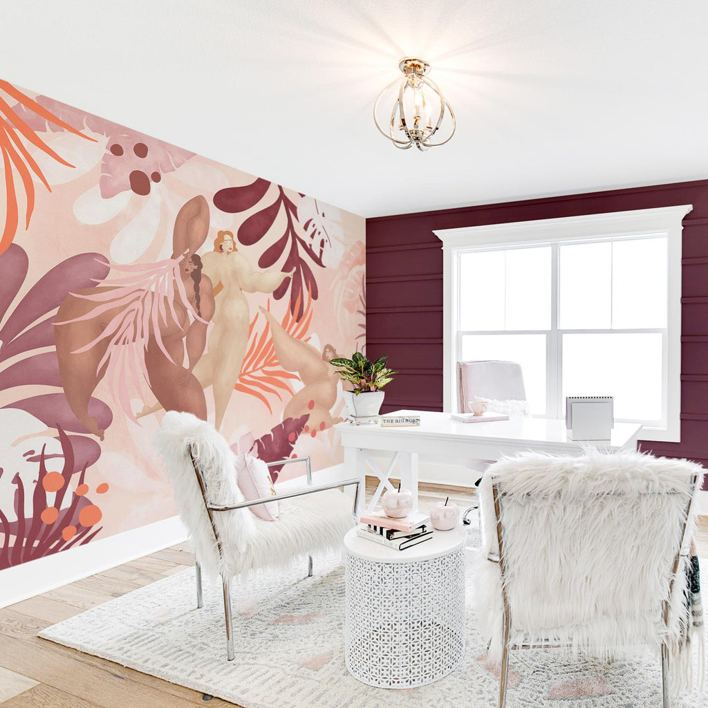 Boho chic home office interior with pink color palette and feminine wall mural