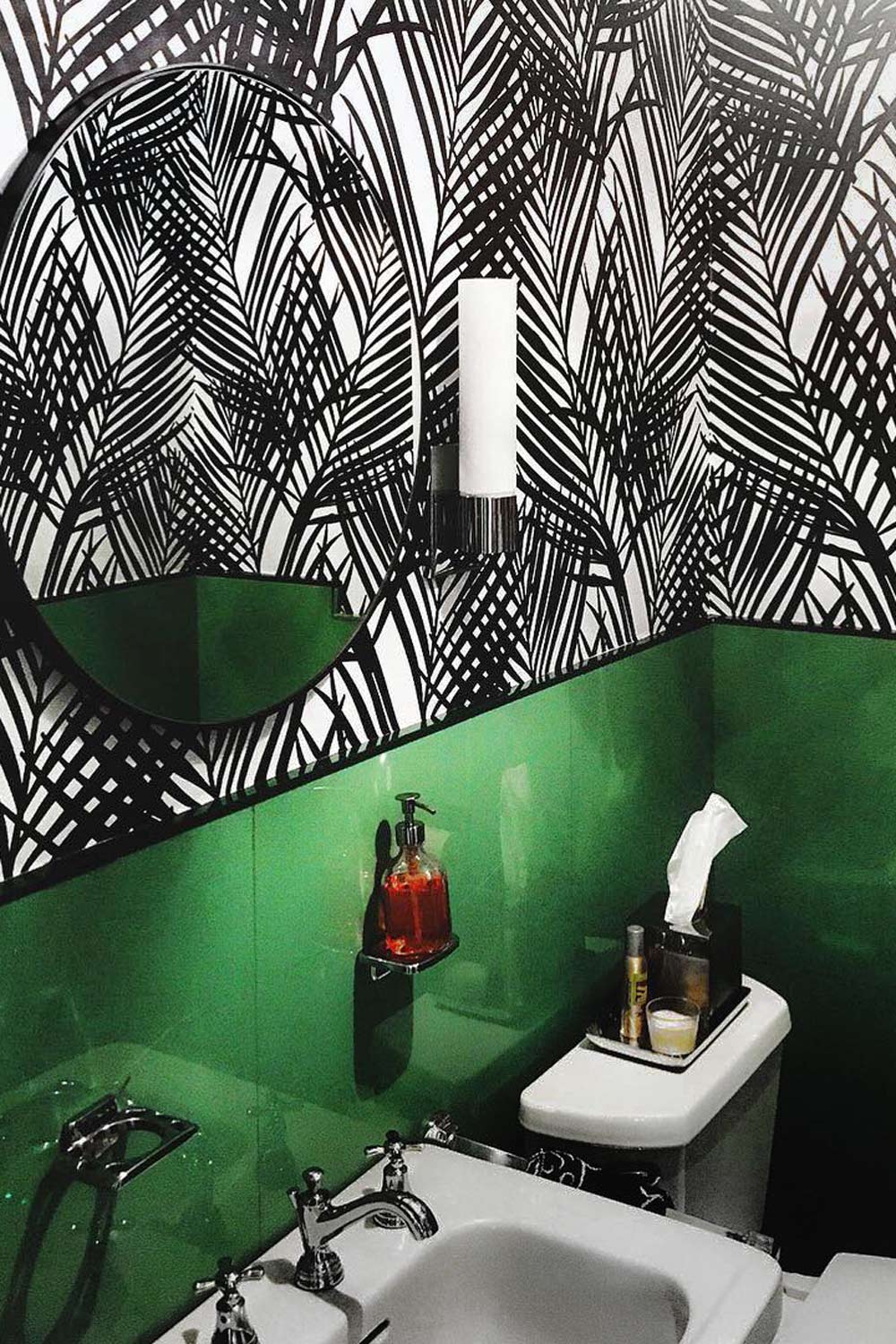 Bold Palm Leaf Wallpaper In Black Bathroom Interior