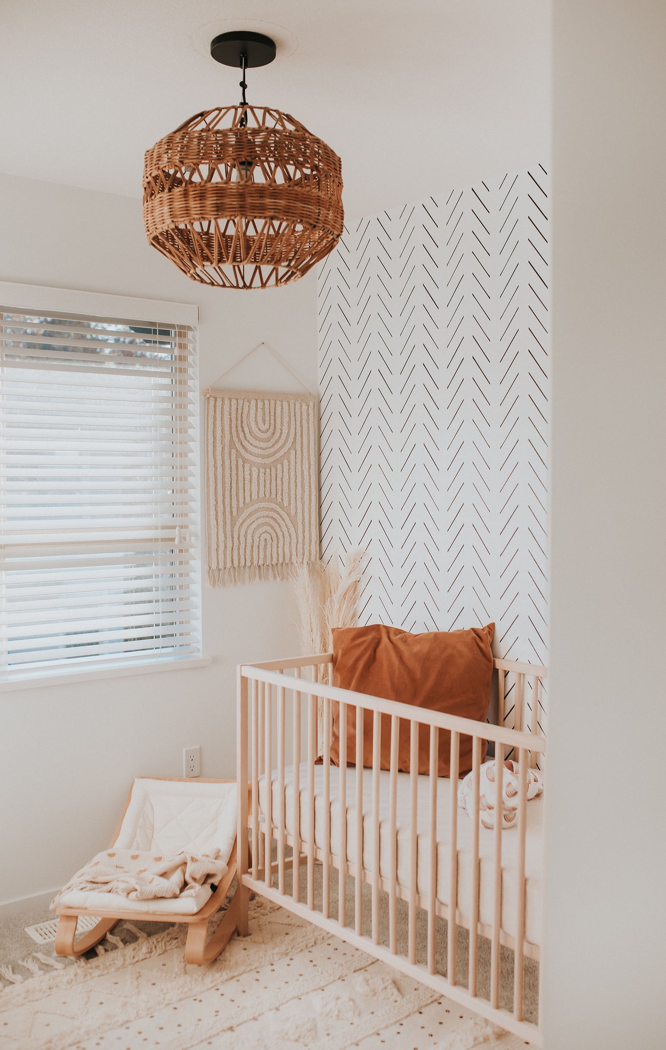 Removable Herringbone wallpaper design in neutral nursery interior