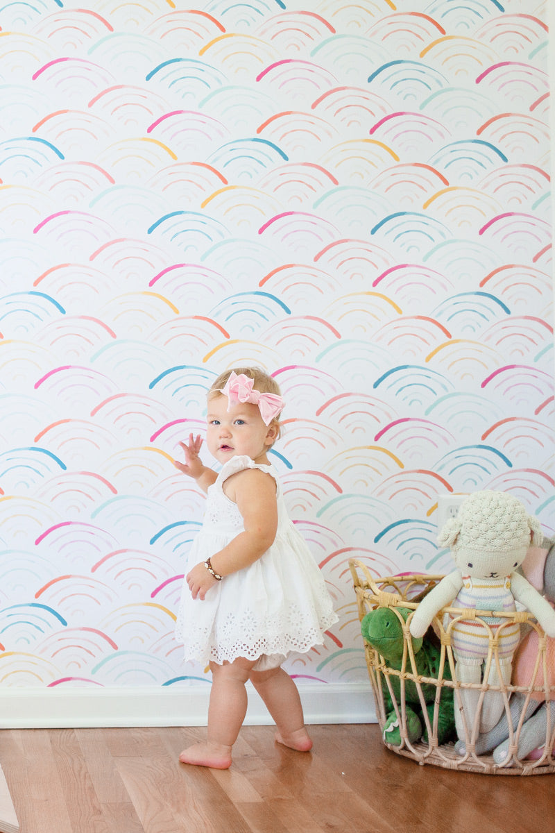 Colorful rainbow wallpaper for playful kids room interior