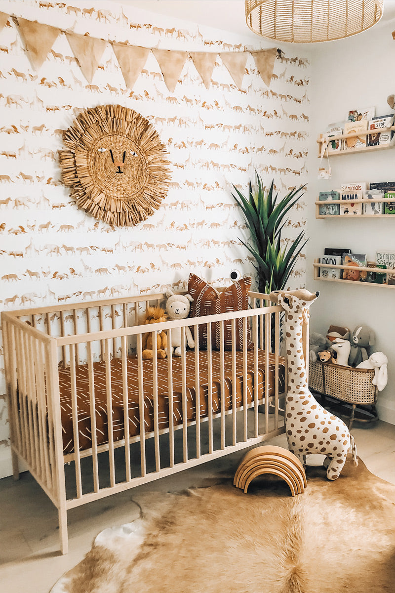 Animal theme inspired nursery interior styled with animal illustration wallpaper