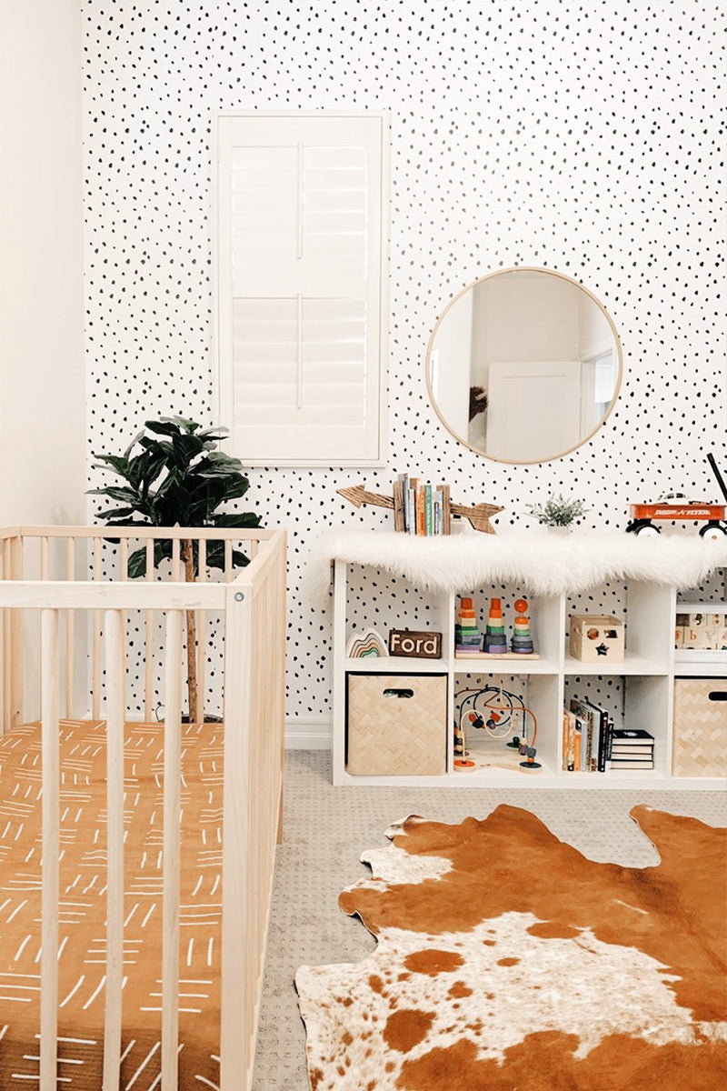 Abstract dot wallpaper in modern nursery interior