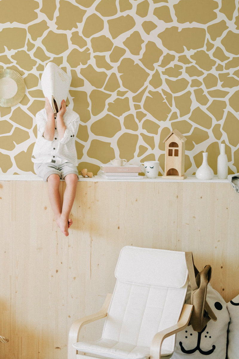 Abstract shape giraffe print wallpaper styled in playroom interior