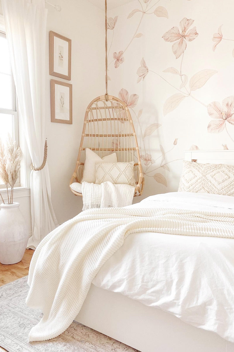 Large pink floral wallpaper in modern boho style girls bedroom interior