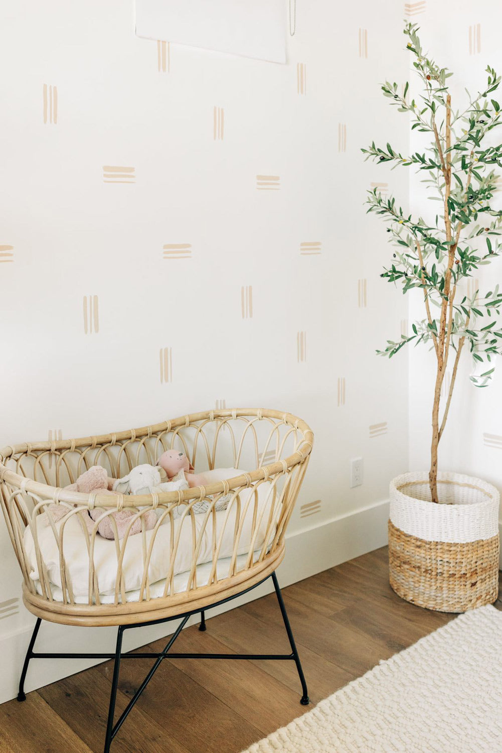Minimalistic girl's nursery featuring removable wallpaper