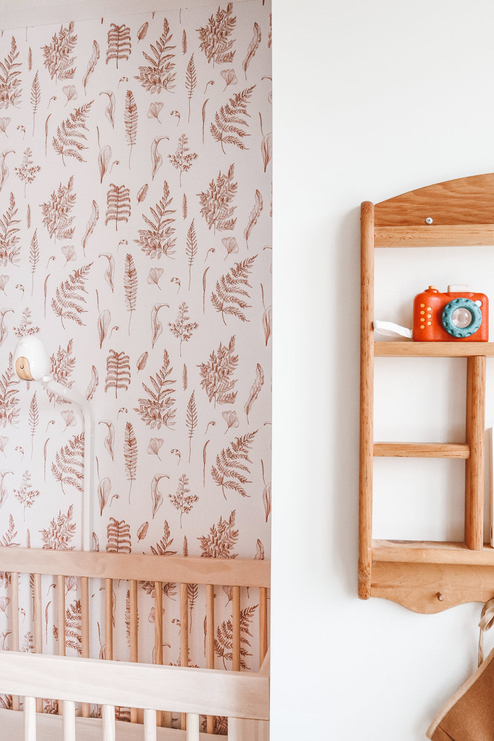Nursery design featuring peel and stick custom wallpaper
