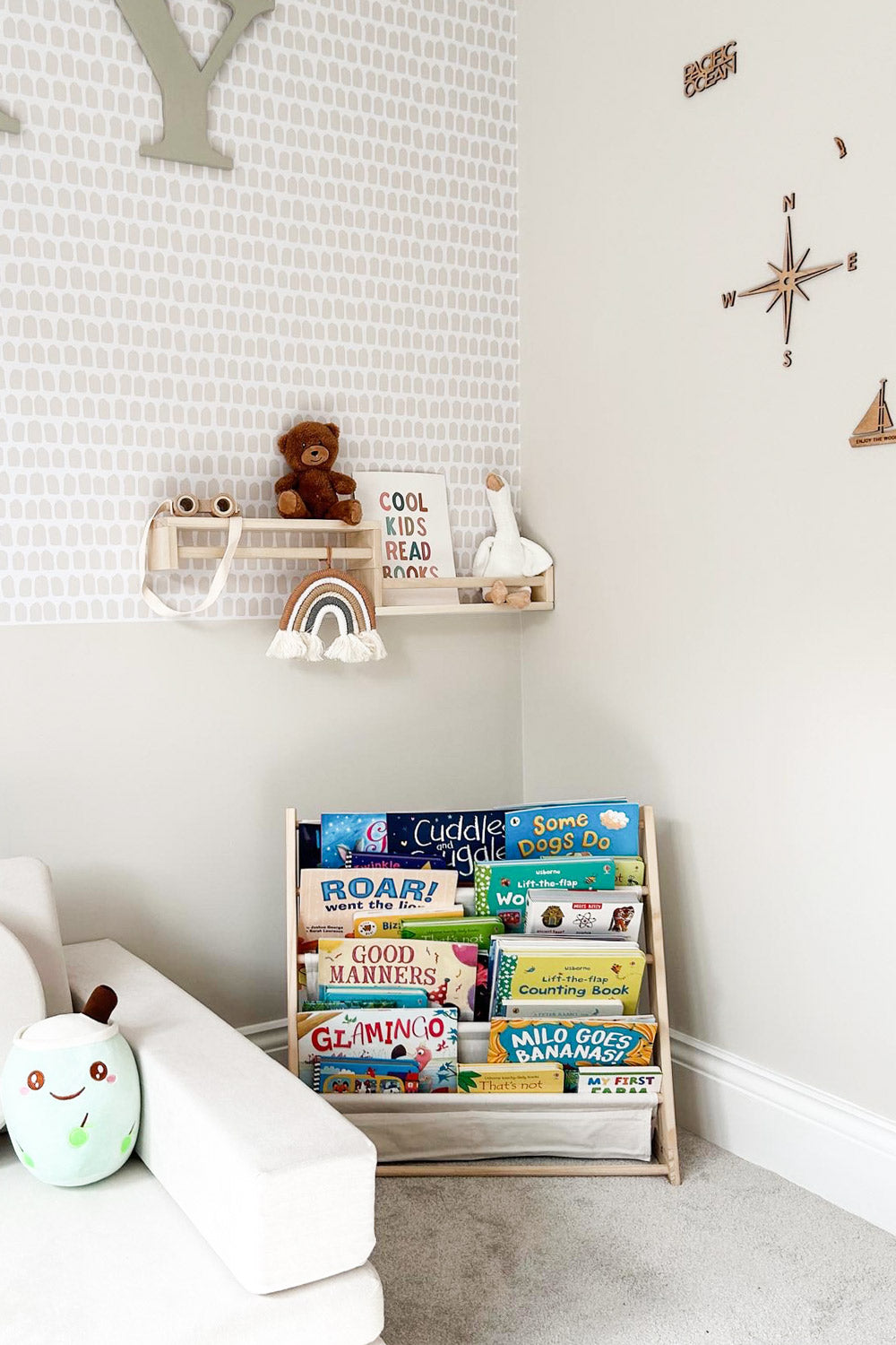 Wallpapered accent wall in kids playroom interior with peel & stick wallpaper