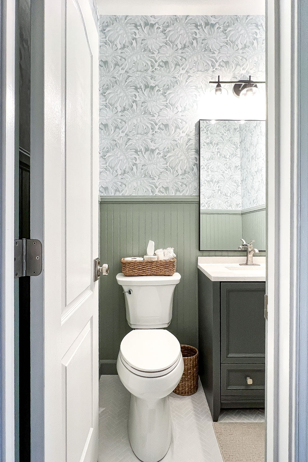 Peel and stick wallpaper in powder room interior