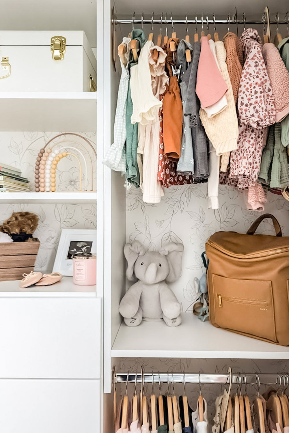 Subtle floral wallpapered nursery closet