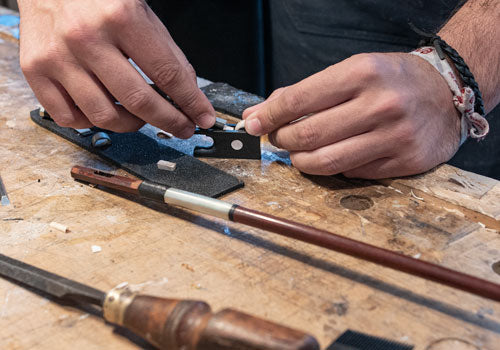 Someone Doing a Violin Bow Rehair