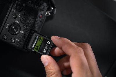 picture of SD card being inserted into camera body