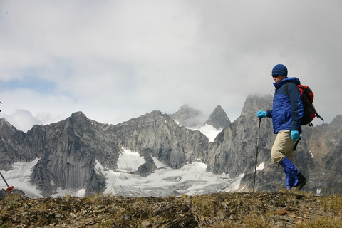 A man hiking in a mountainous terrain