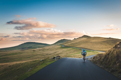 A person cycling in the countryside