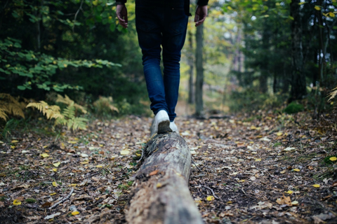 A hiker on a log