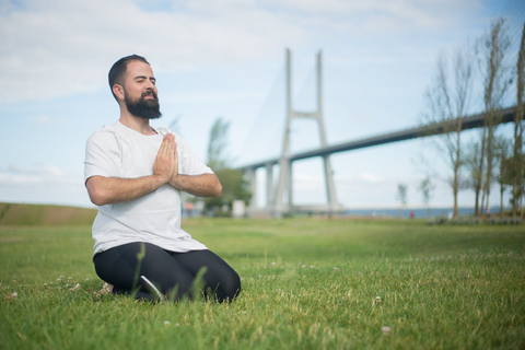 a person meditating outdoors