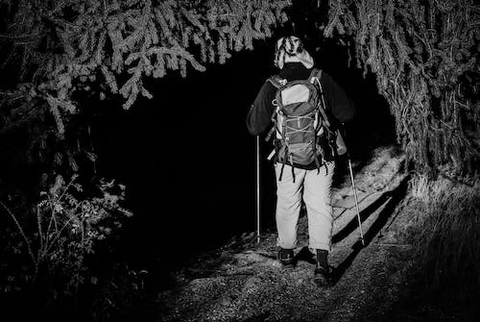 person hiking at night