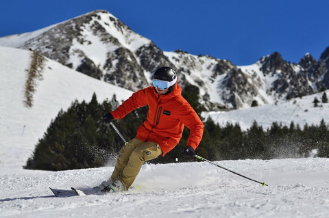 A man while skiing on a snowfield