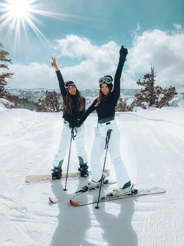 photo-of-two-women-skiing