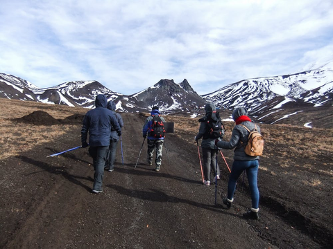 Skiers walking toward their skiing destination