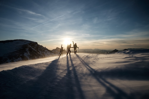 Three skiers having fun