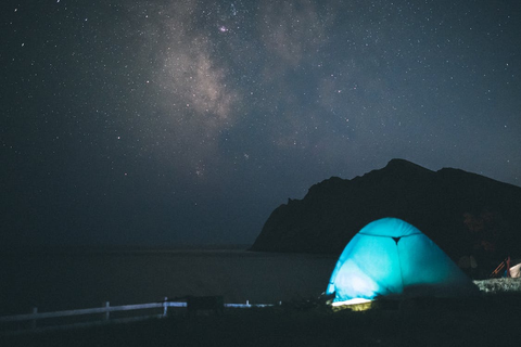 A camping tent under the starry sky 