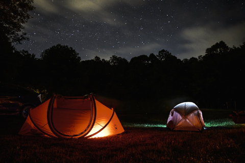 Two camping tents during night-time