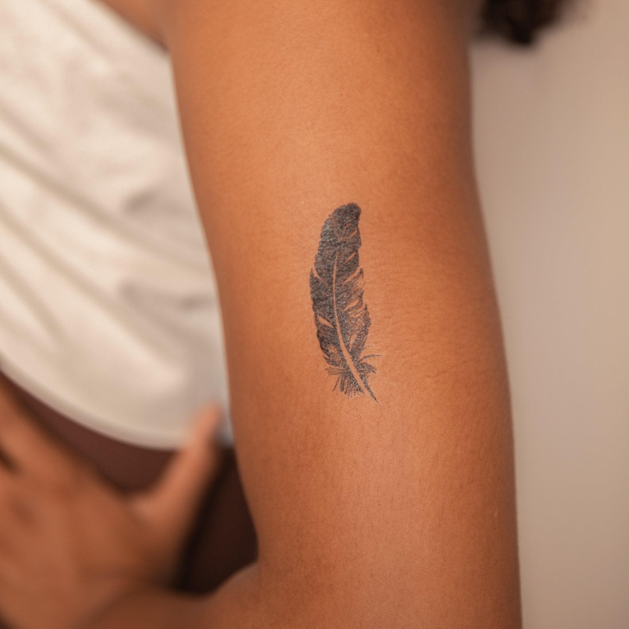 25 Feather Tattoo Designs  Meaning 2023  The Trend Spotter