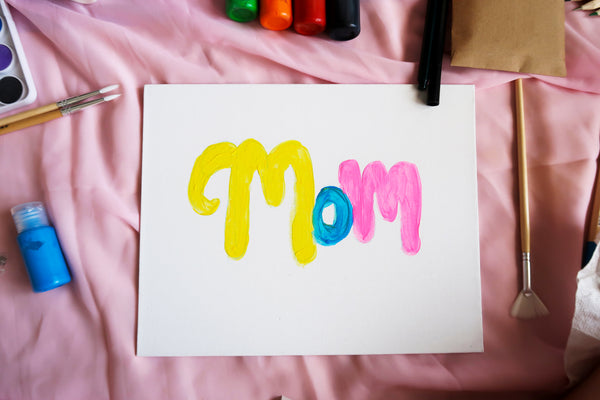 painted word mom with a second layer of paint