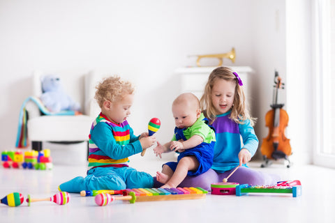 babies playing instruments teething jewelry