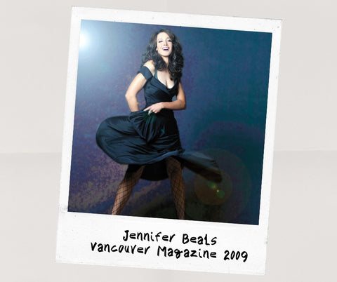 Polaroid of Jennifer Beals twirling a dark dress and laughing, shot for Vancouver Magazine in 2009 by Kharen Hill