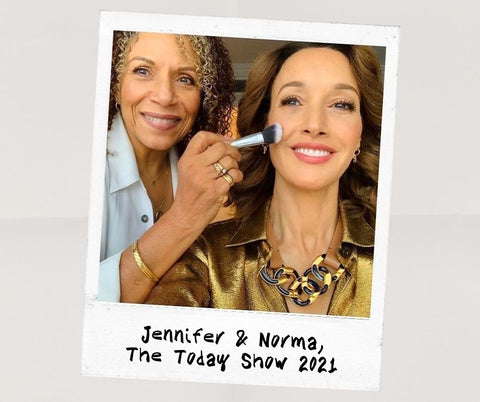 Celebrity Makeup Artist Norma (left) holding SAPPHO vegan makeup brush to Jennifer Beals' smiling face, polaroid-style reads Jennifer & Norma, The Today Show 2021