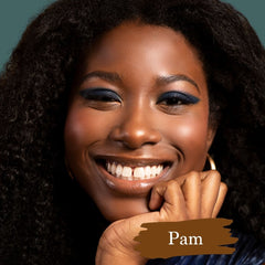 Dark skin model wearing Pam foundation shade for Essential natural foundation