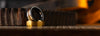 Two gold and wooden rings on a table